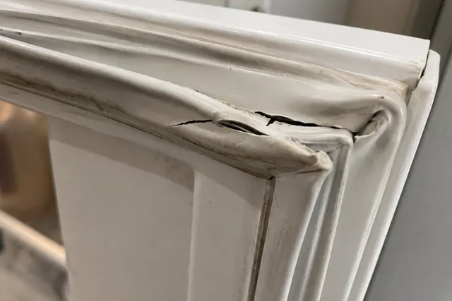 Cracked refrigerator door gasket that can contribute to a fridge freezing food